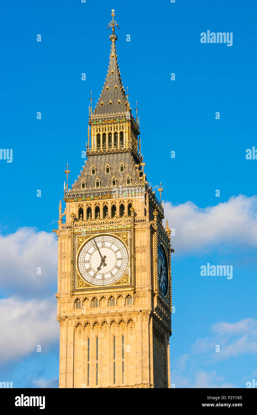 Big Ben clock tower  above the Palace of Westminster and houses of Parliament City of London England UK GB EU Europe Stock Photo