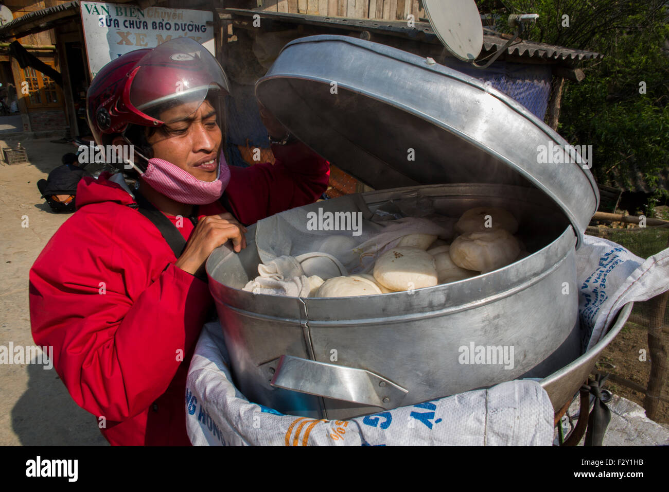Vietnamese man selling dumplings Stock Photo