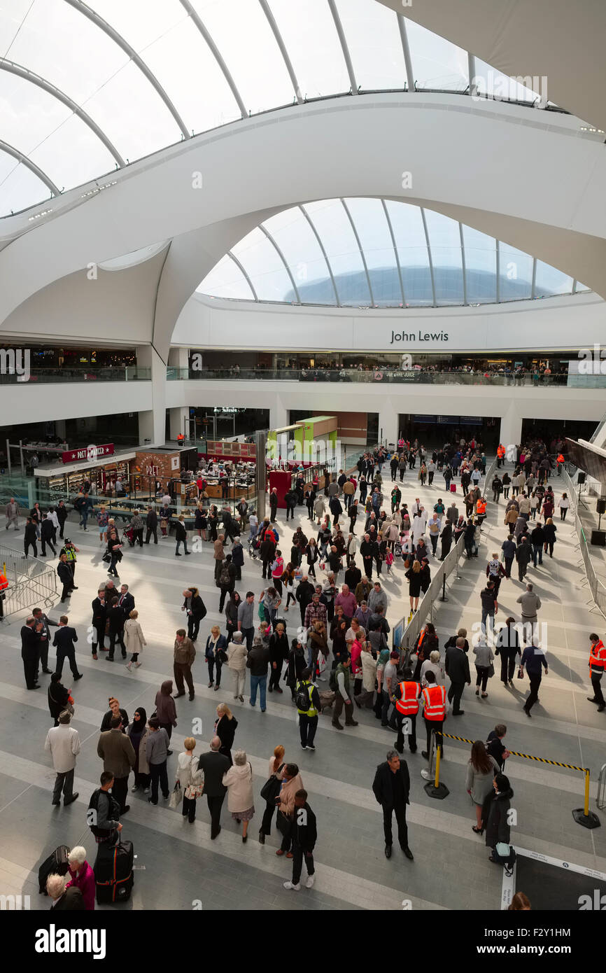 Rail travellers and shoppers inside the atrium on the opening day of Grand Central shopping centre, Birmingham, England, UK Stock Photo