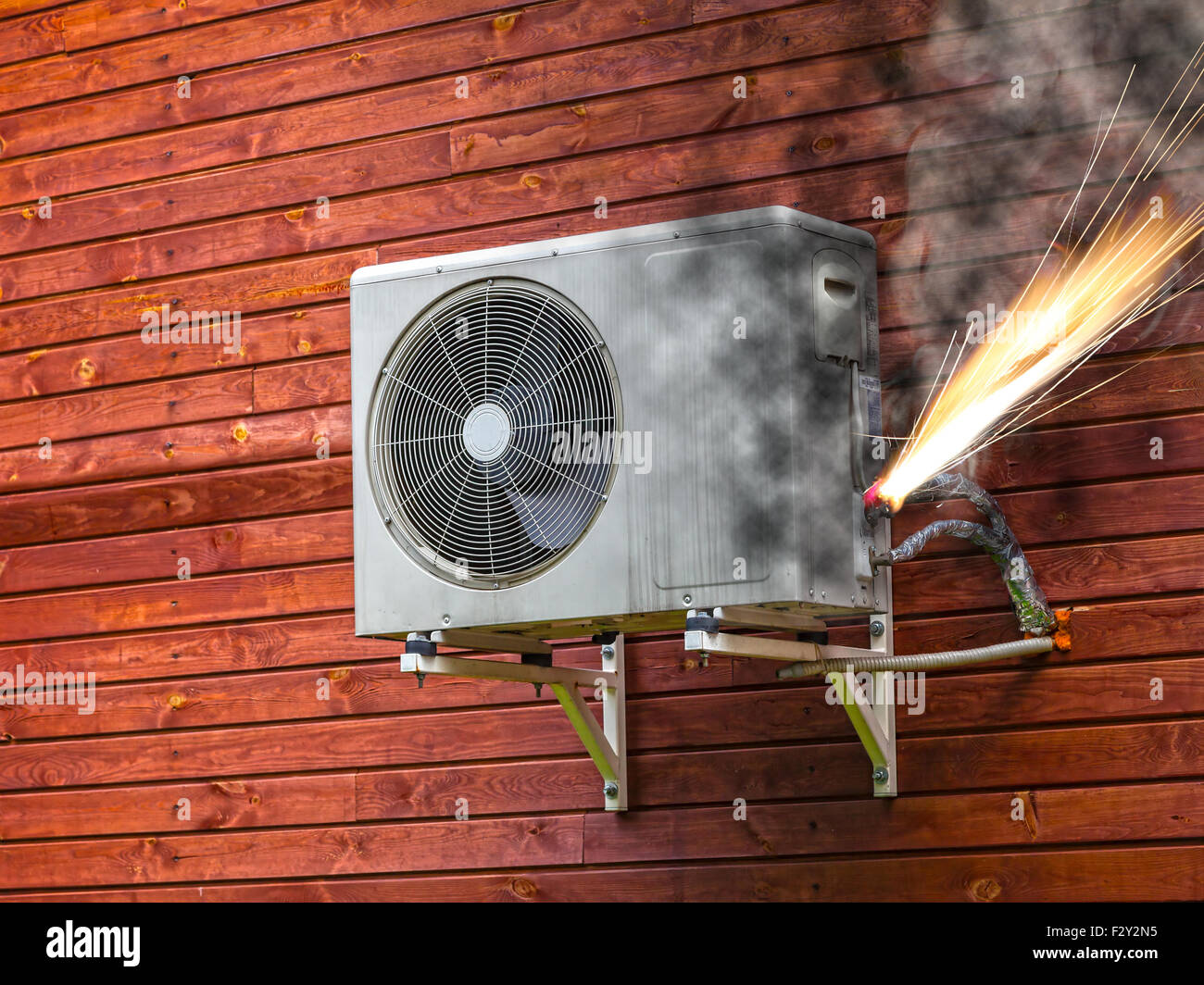 Overloaded electrical circuit causing electrical short and fire Stock