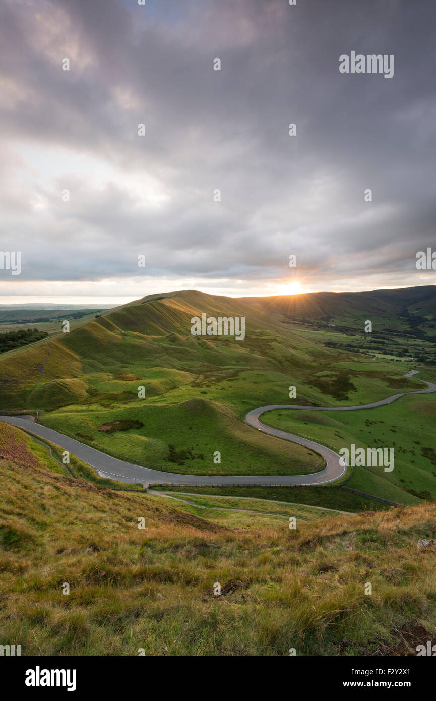 The Winding road leading to Edale and Rushup Edge at sunset, Peak District National Park, Derbyshire Stock Photo