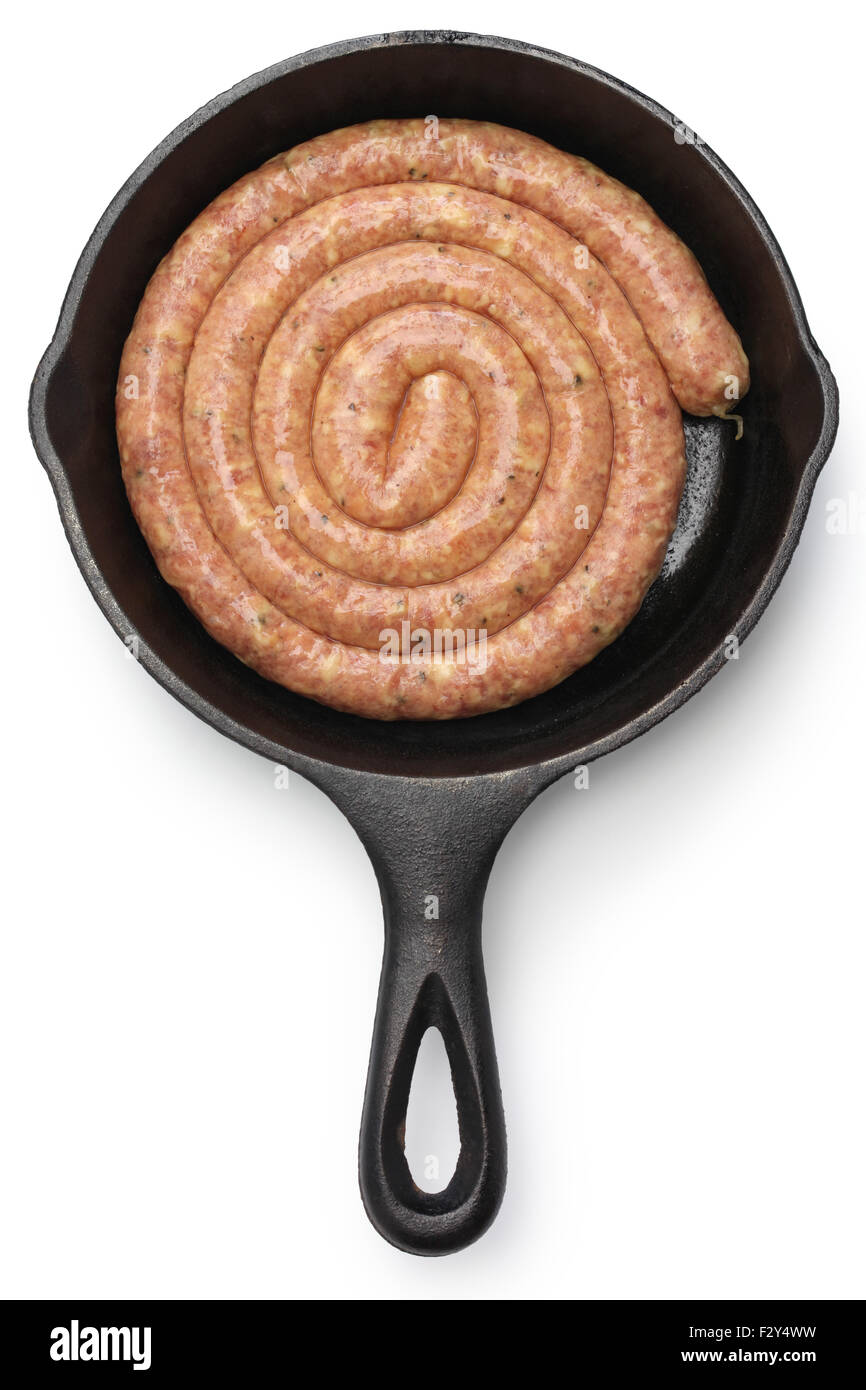 raw cumberland sausage, spiral pork sausage on skillet isolated on white background Stock Photo
