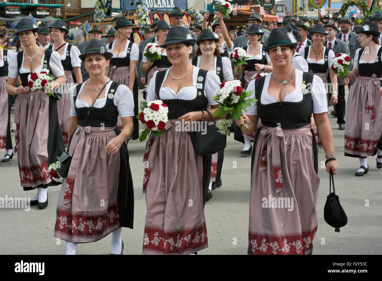 MUNICH, GERMANY – SEPT. 20, 2015: Traditional Marching Group with Local Costumes entertain Crowds of visitors at the annual Oktoberfest. The Festival runs from September 19th until October 4th 2015 in Munich, Germany. Stock Photo