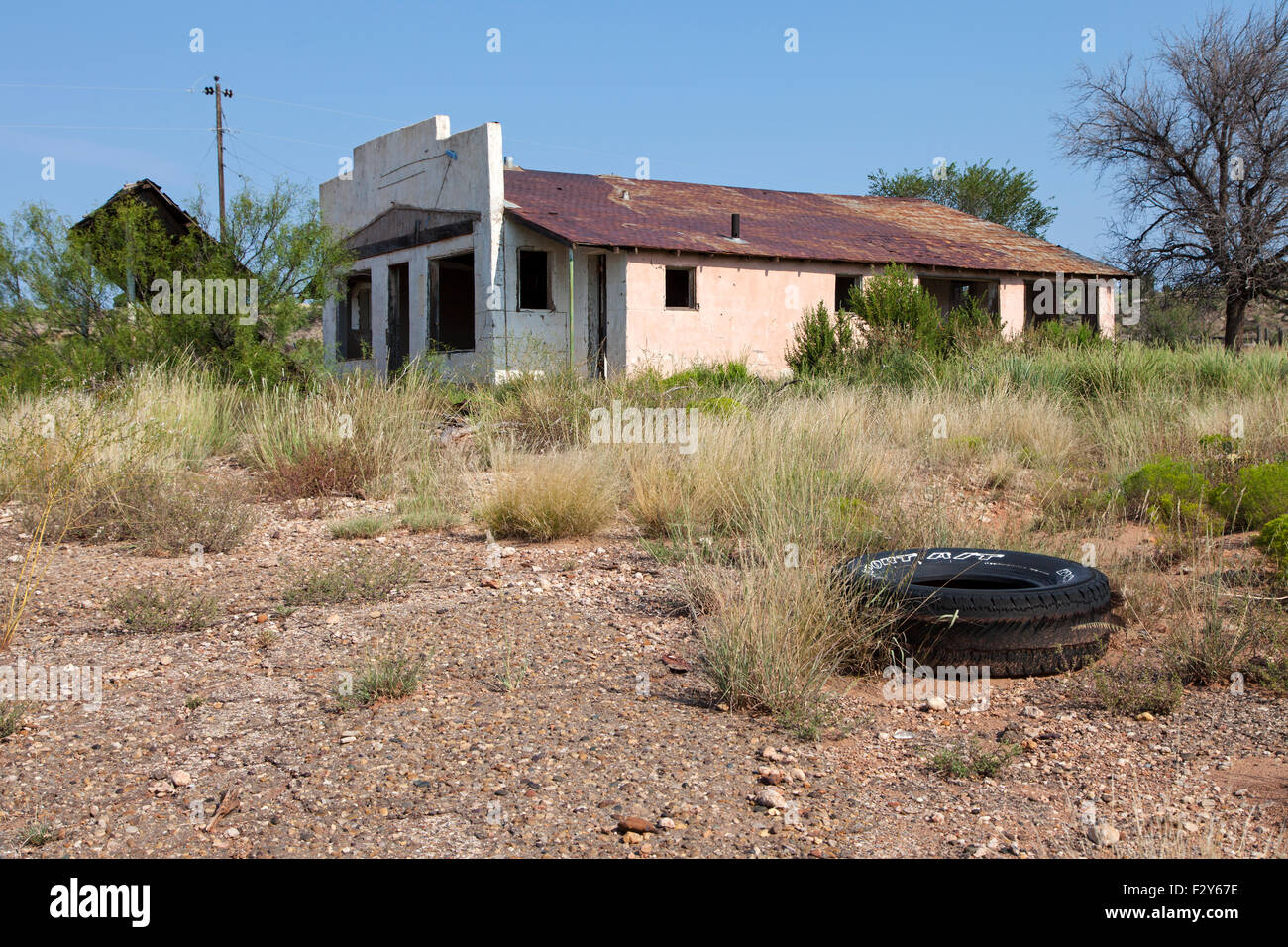 An abandoned gas station and restaurant sits along a bypassed section