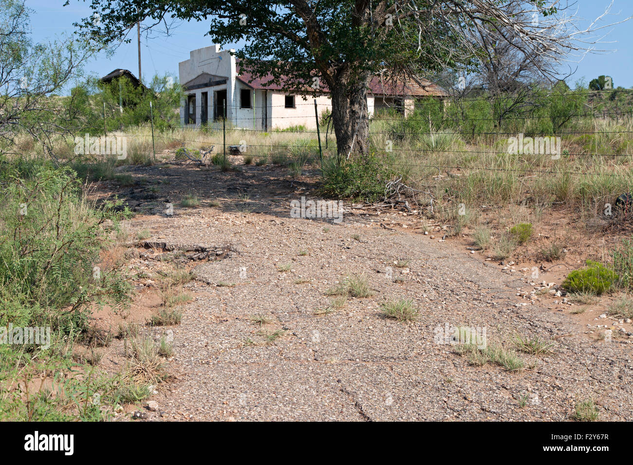 An abandoned gas station and restaurant sits along a bypassed section