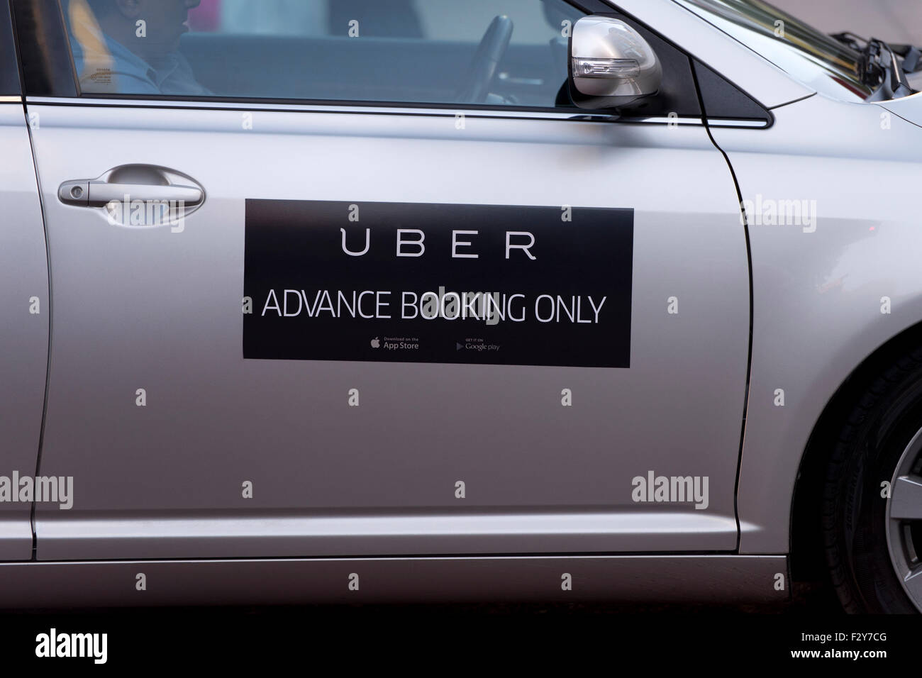 The logo on the side of an Uber taxi seen in Manchester city centre (Editorial use only). Stock Photo