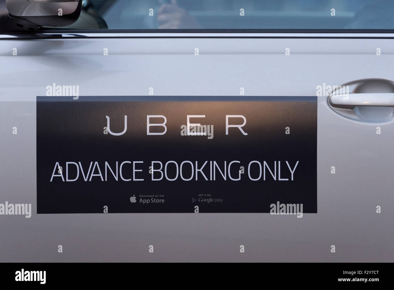 The logo on the side of an Uber taxi seen in Manchester city centre (Editorial use only). Stock Photo