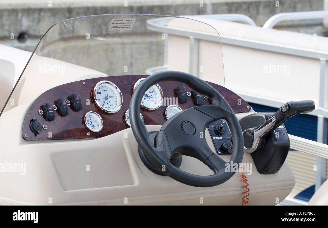 Helm station console steering wheel on a pontoon deck boat Stock Photo ...