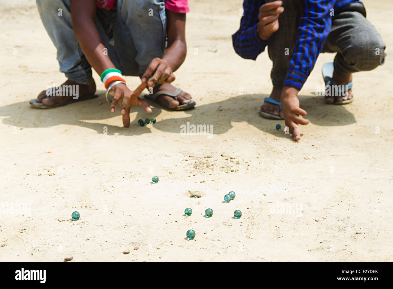 2 Rural kdis Boys Playing Marble Stock Photo