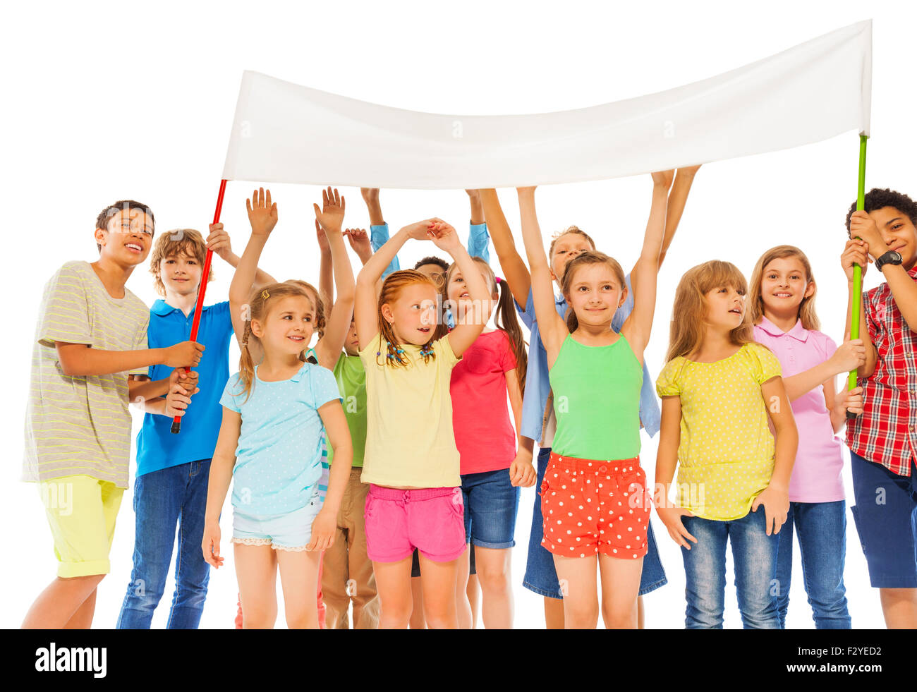 Group of happy kids hold empty white banner Stock Photo - Alamy