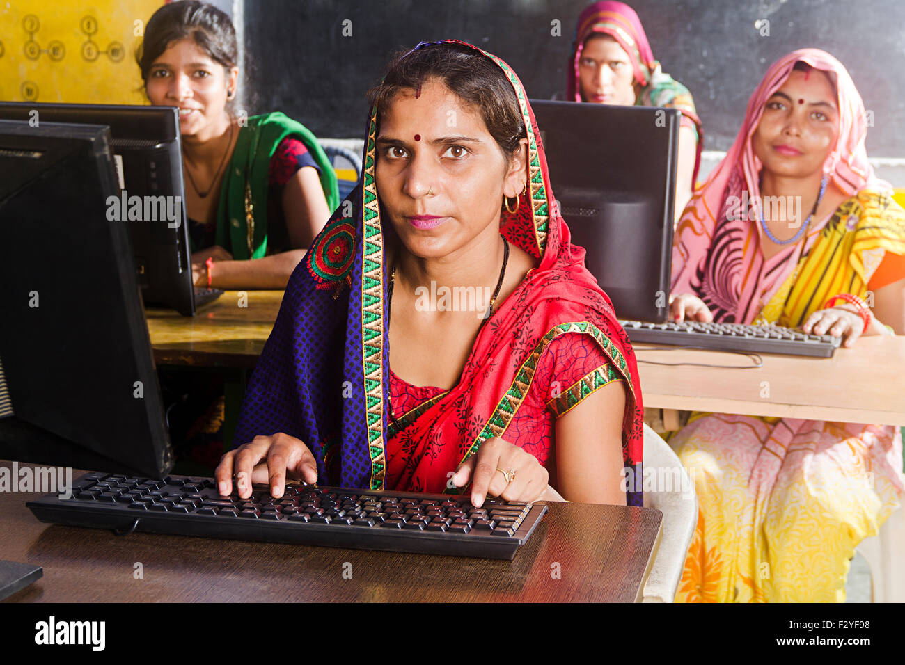 4 indian rural Villager womans School Computer Education Stock Photo