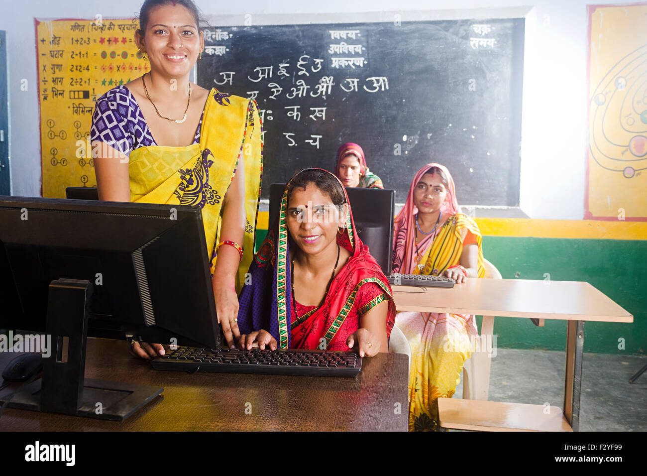 4 indian rural Villager womans School Teacher Computer Education Stock Photo
