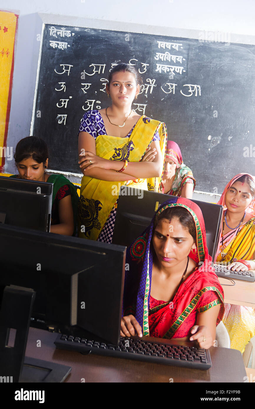 indian rural Villager group crowds womans School Teacher Computer Education Stock Photo