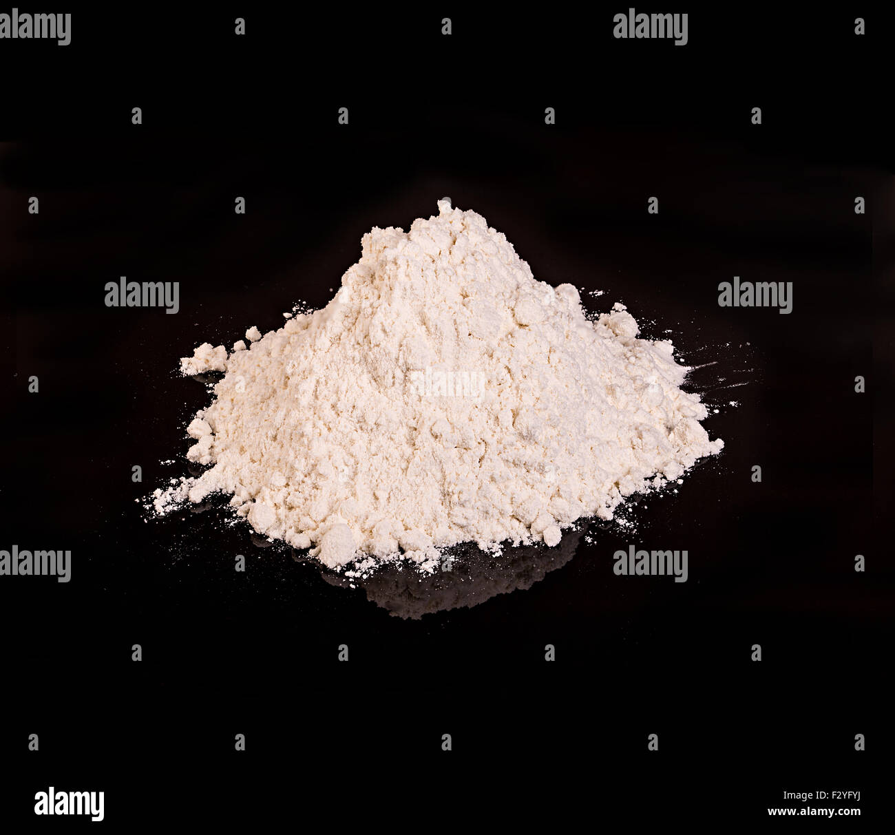 Drug powder close-up on a black background. Stock Photo