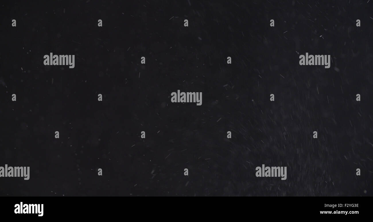 abstract particles flying over black background Stock Photo - Alamy