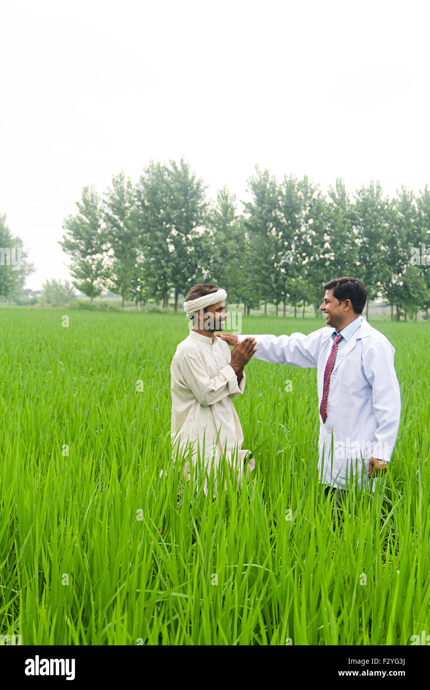 2 indian Doctor and rural farmer Farm Examining Stock Photo Alamy