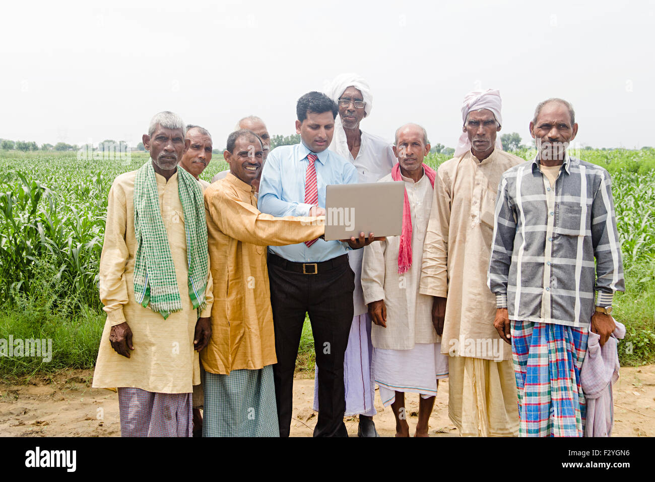 indian group crowds Business Man and rural farmer farm laptop working Stock Photo