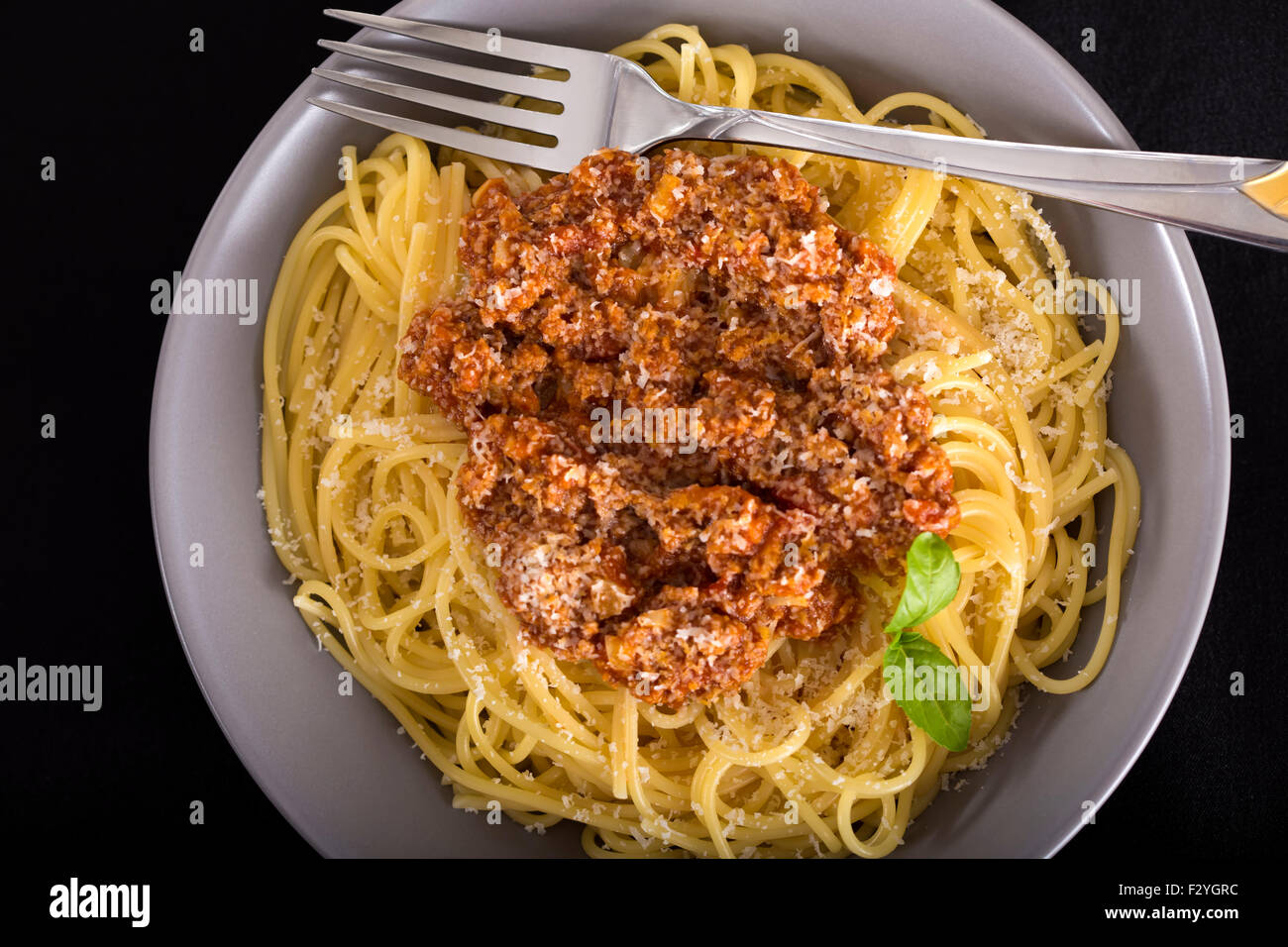 Spaghetti with Bolognese Sauce Parmesan and basil Stock Photo