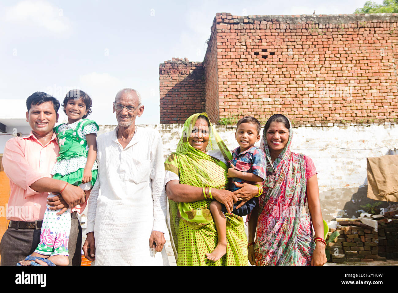 indian group crowds rural villager family home standing Stock Photo