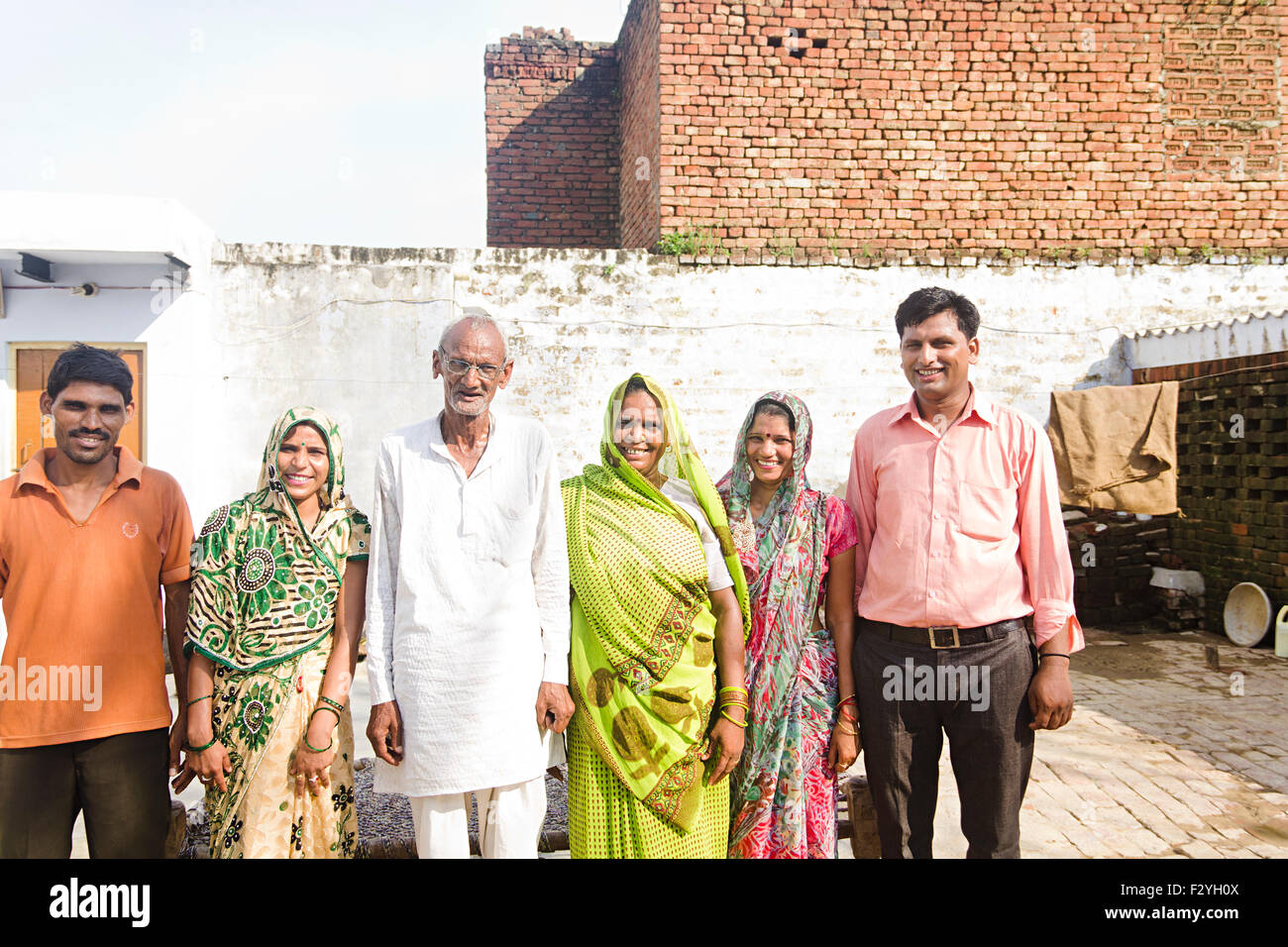 indian group crowds rural villager family home standing Stock Photo