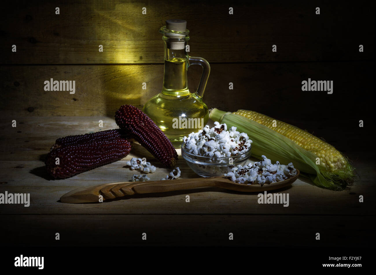 Still life with corn, popcorn and corn oil Stock Photo
