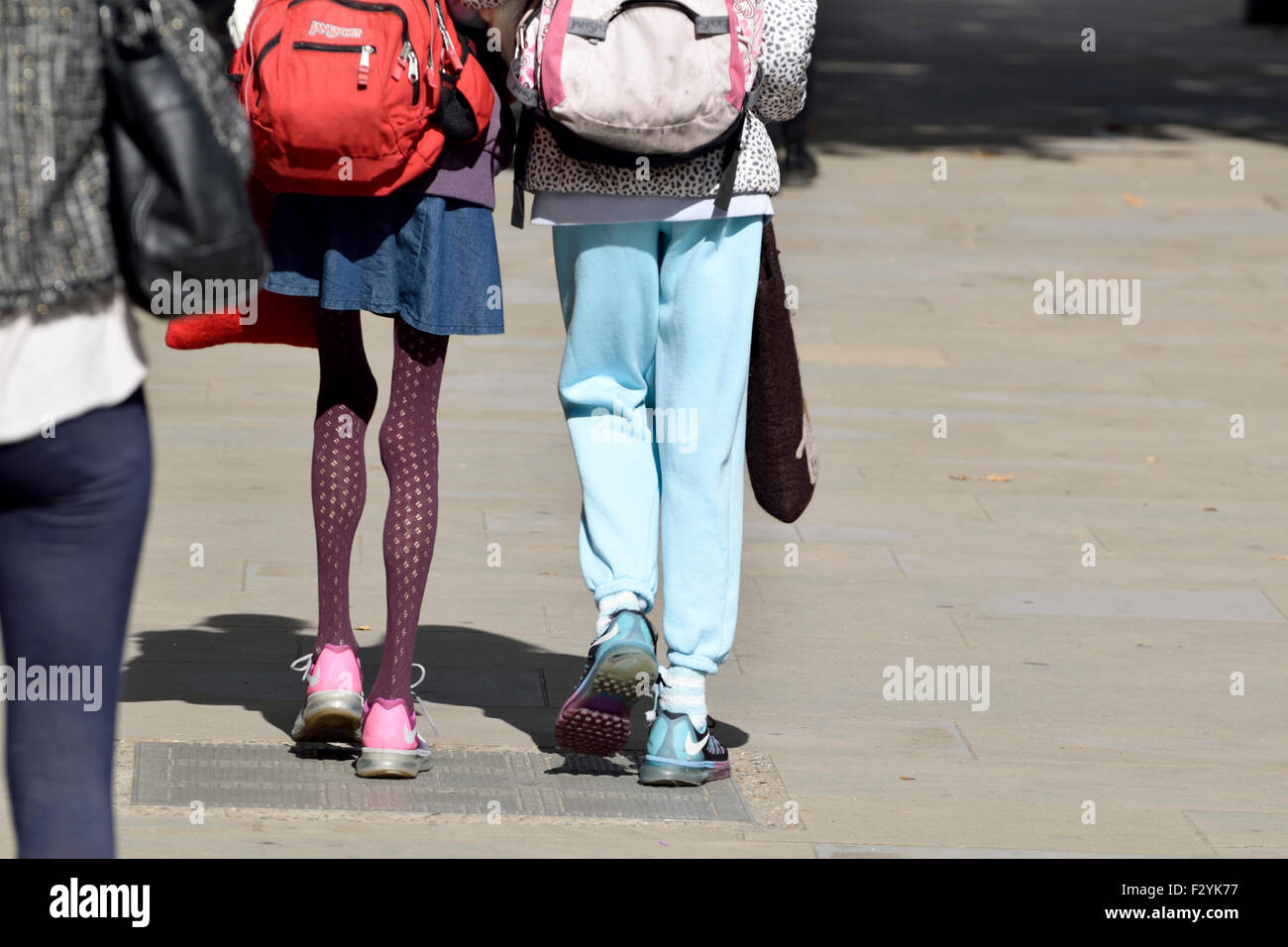 London, England, UK. Woman with very thin legs, walking with a friend Stock Photo