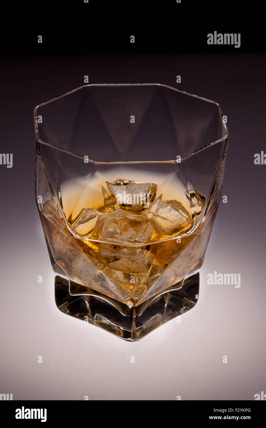 brandy in a glass on ice cubes Stock Photo Alamy