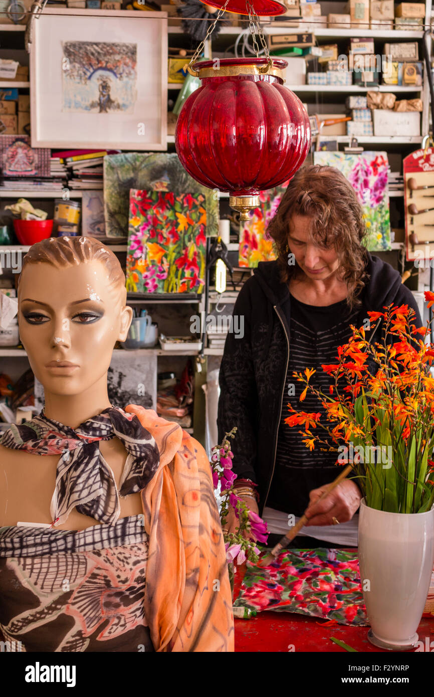 Artist in her workshop with shelving and mannequin model. Cahersiveen county Kerry Ireland Stock Photo