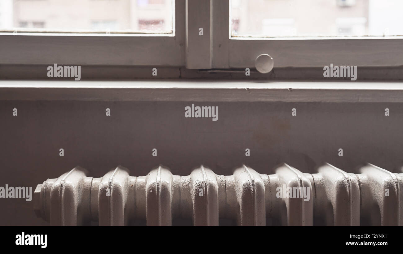 Simple composition presenting an old style radiator. Home interior of a ...