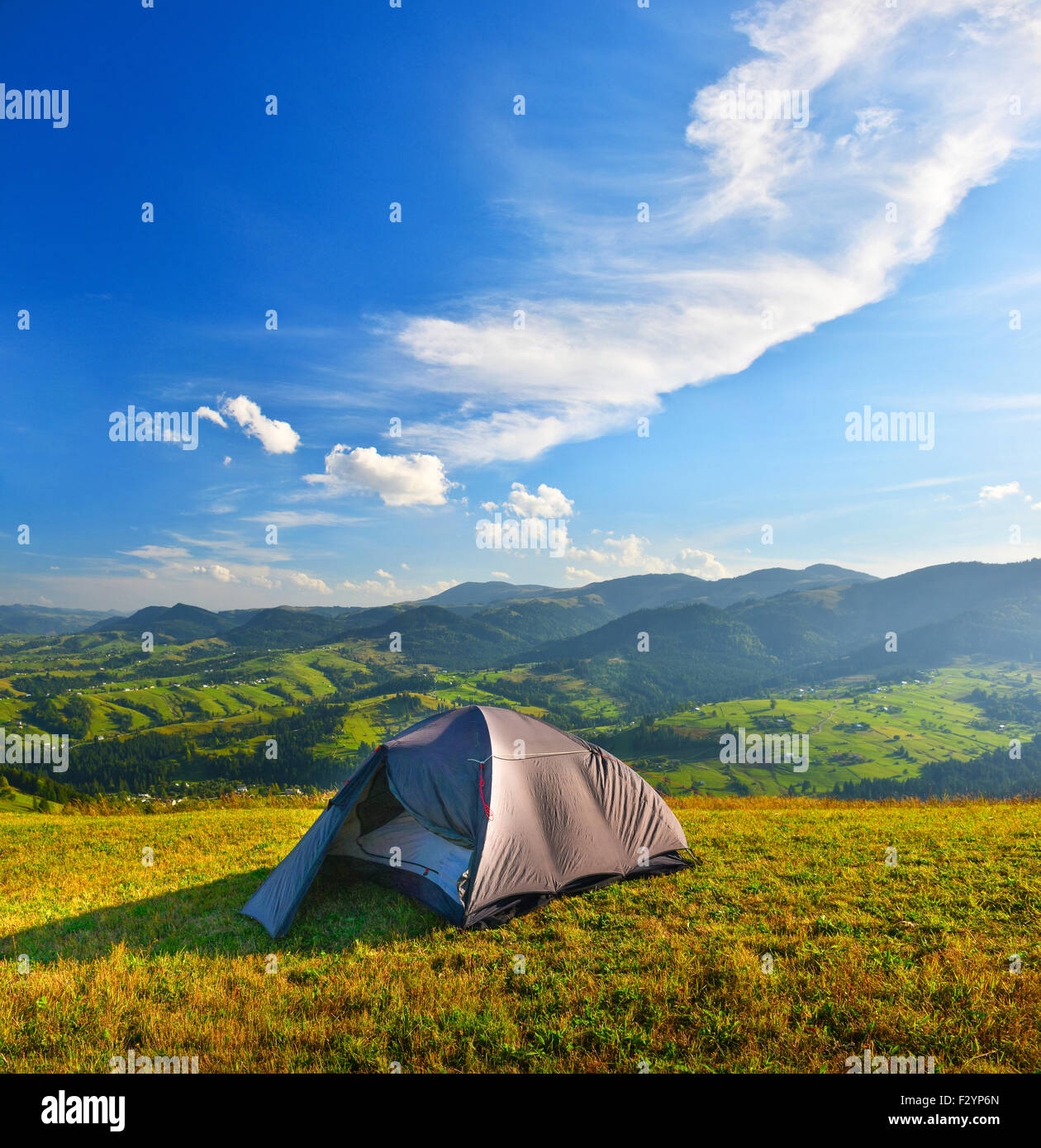 Tourist tent in the summer mountains. Stock Photo