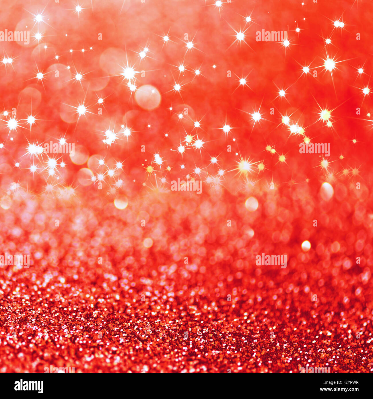 Red defocused glitter background with copy space Stock Photo