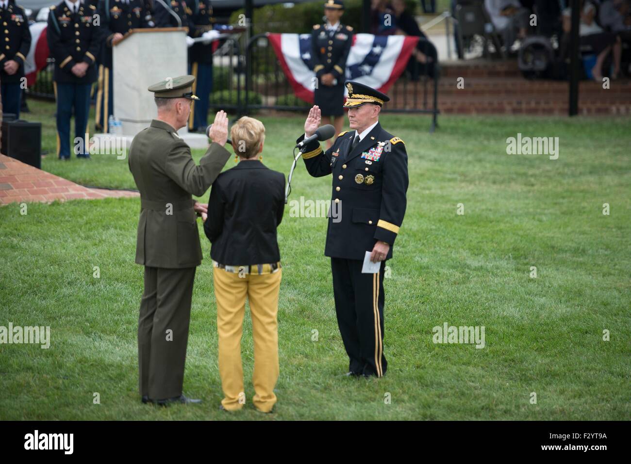 Arlington, Virginia, USA. 25th Sep, 2015. Outgoing Chairman of the Joint Chiefs Army Gen. Martin Dempsey administers the oath to incoming Chairman Marine Gen. Joseph Dunford during a change of responsibility ceremony at Joint Base Myer-Henderson Hall September 25, 2015 in Arlington, Virginia. Gen. Dempsey retires from the military after 41 years in service and is succeeded by Marine Gen. Joseph Dunford. Stock Photo