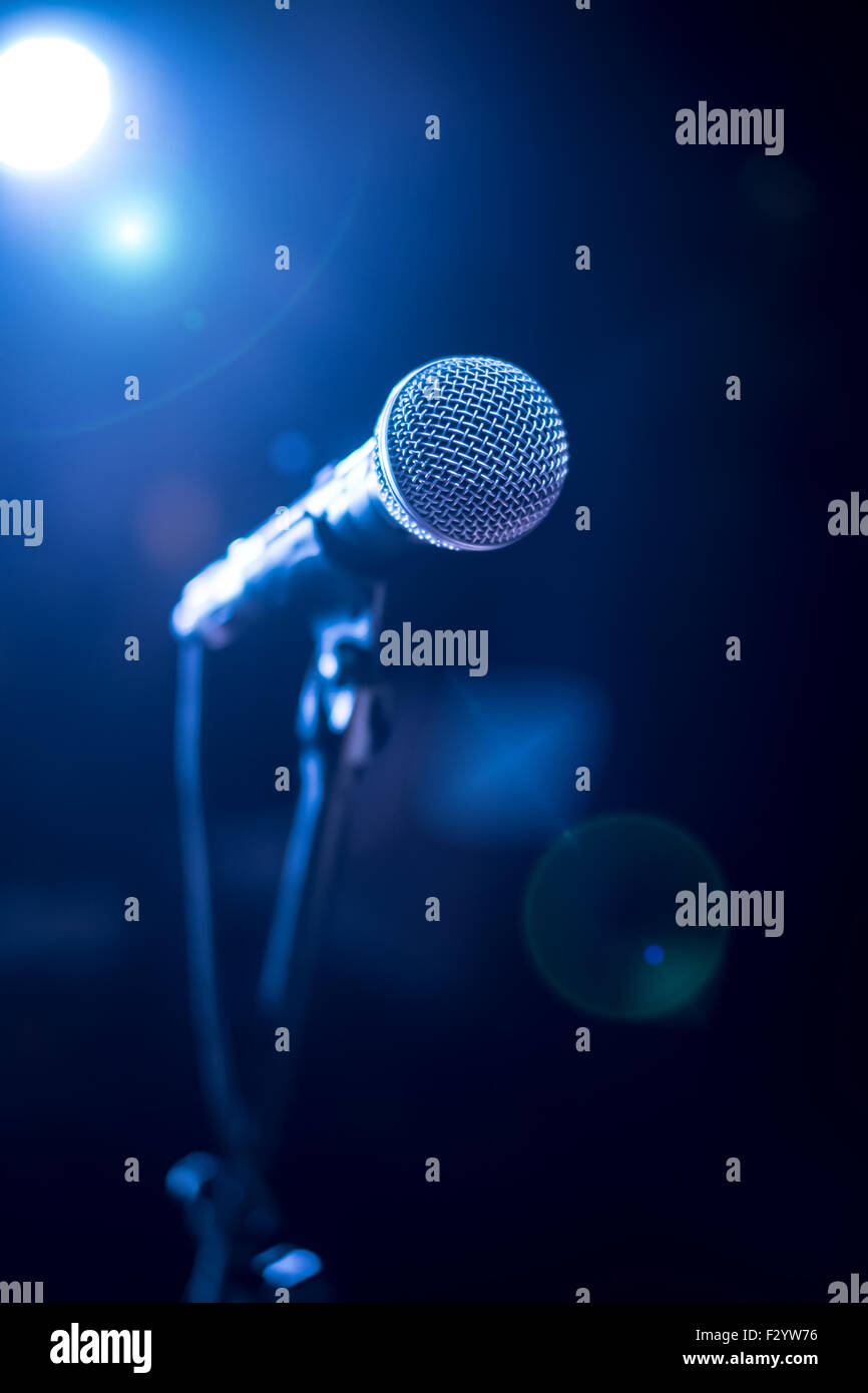 Microphone on stage against a background of auditorium Stock Photo