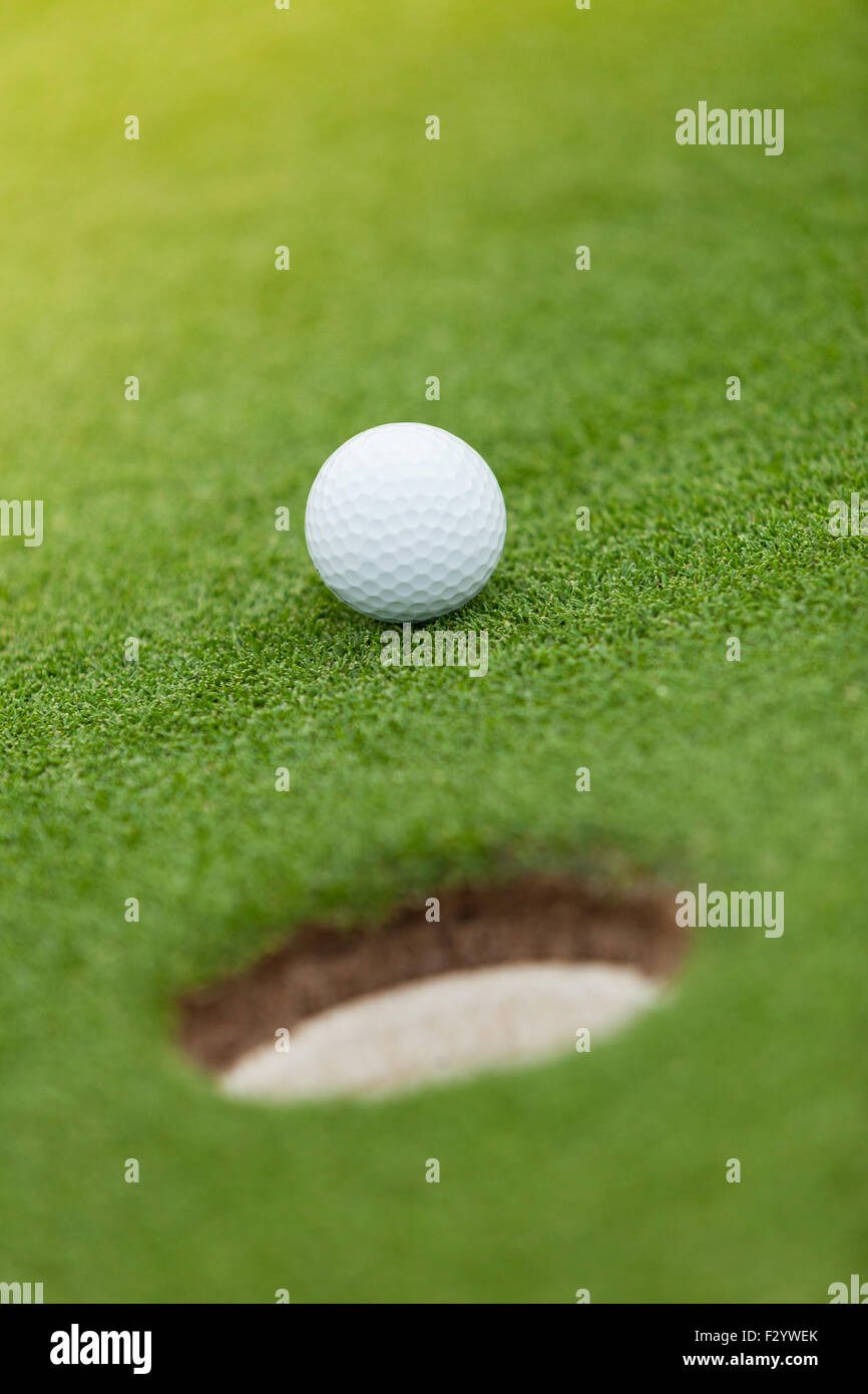 Golf ball on the green lawn Stock Photo Alamy