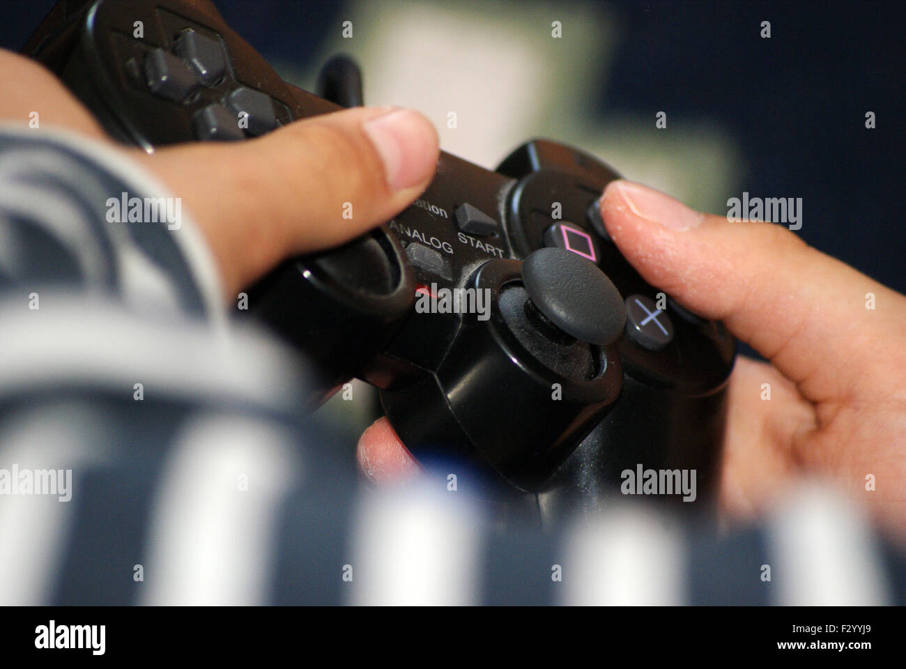 Boys hands and some home entertainment Stock Photo