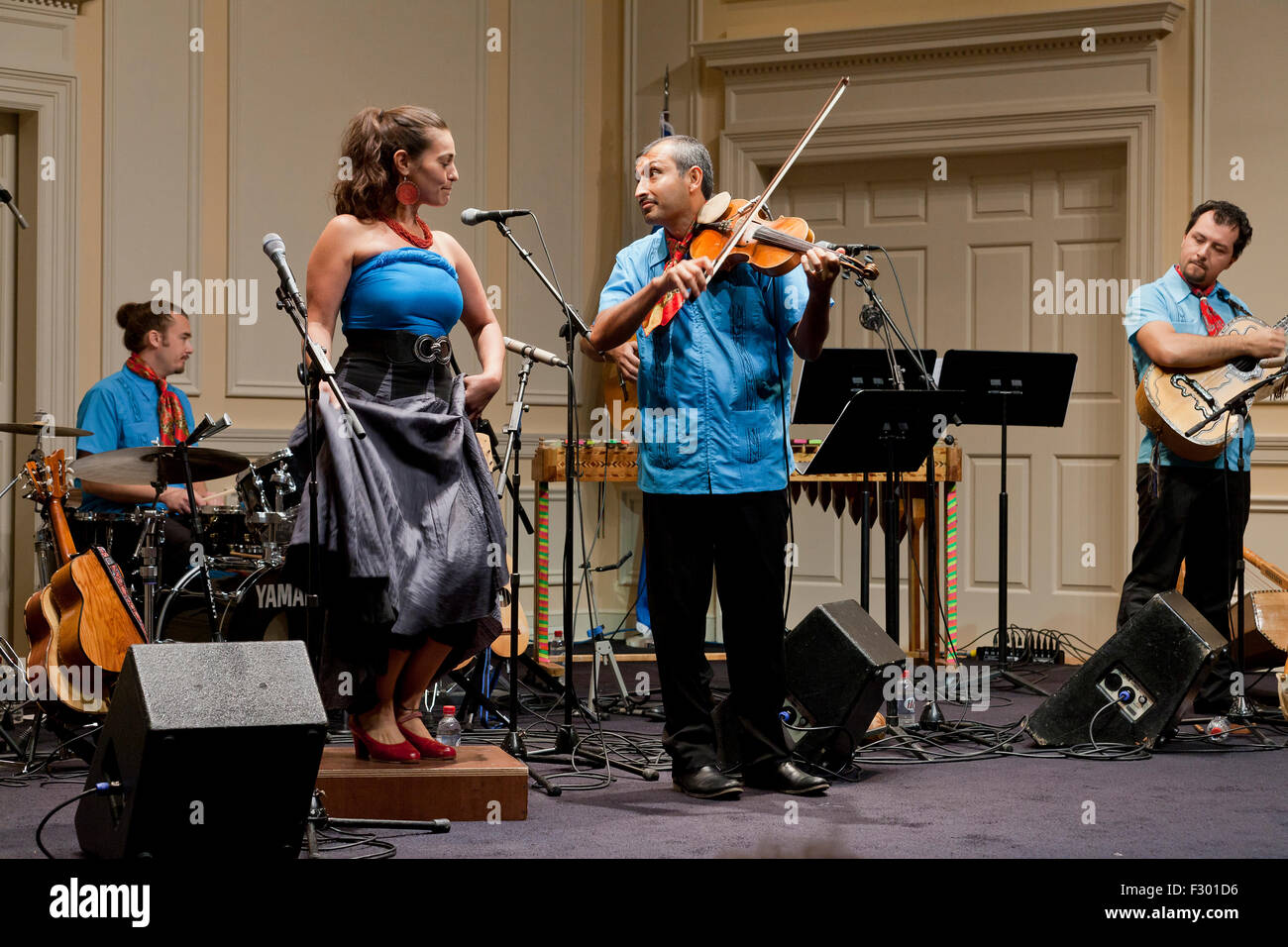 Mexican fiddle player and dancer on stage Stock Photo