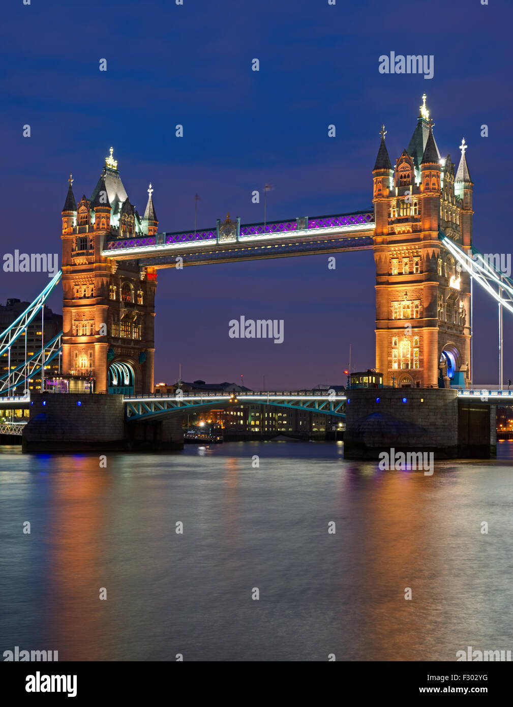 The illuminated Tower Bridge in London after sunset Stock Photo