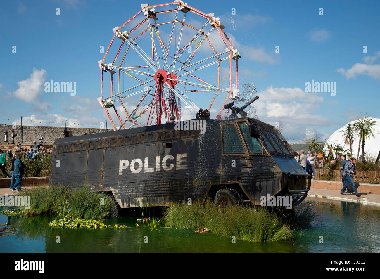 Dismaland, Water Cannon Creek. The armour plated riot control vehicle was built to serve on the streets of Northern Ireland Stock Photo