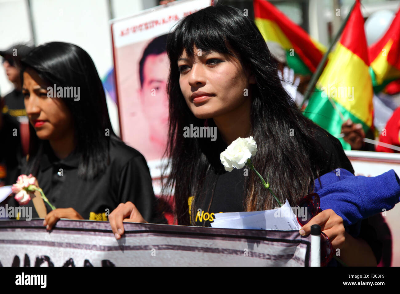 La Paz, Bolivia, 26th September 2015. Evaliz Morales (left, daughter of  Bolivian president Evo Morales) leads a march to the Mexican Embassy in La  Paz to commemorate the first anniversary of the