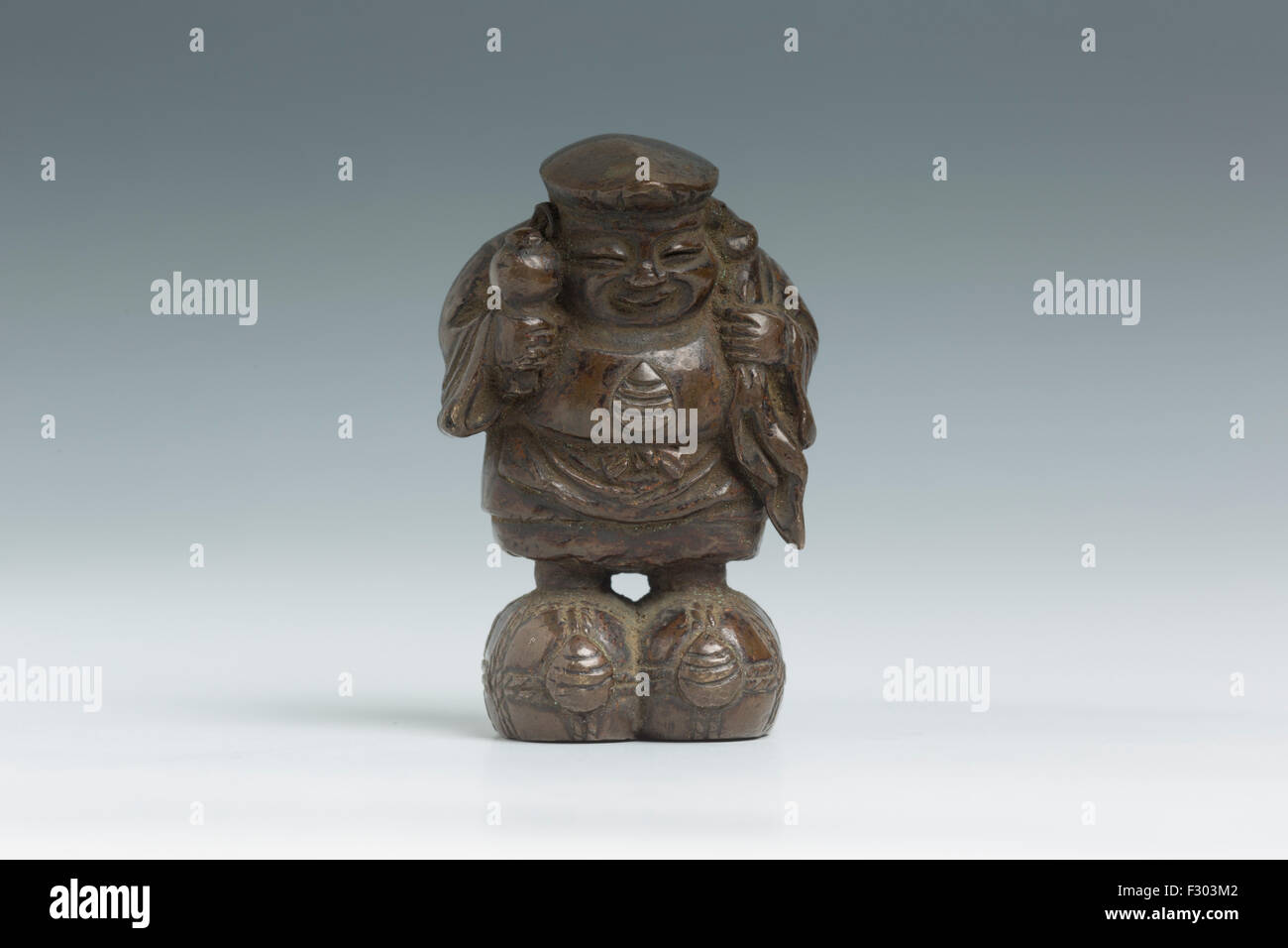 Japanese bronze figure of Daikokuten, one of the Japanese immortals. Stock Photo