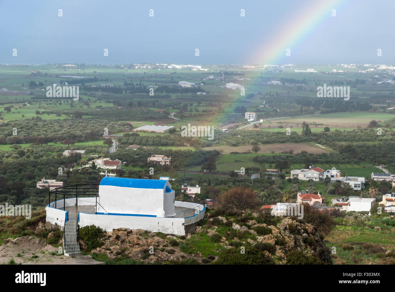 Rainbow over traditional church after rain in Kos Island, Greece Stock Photo