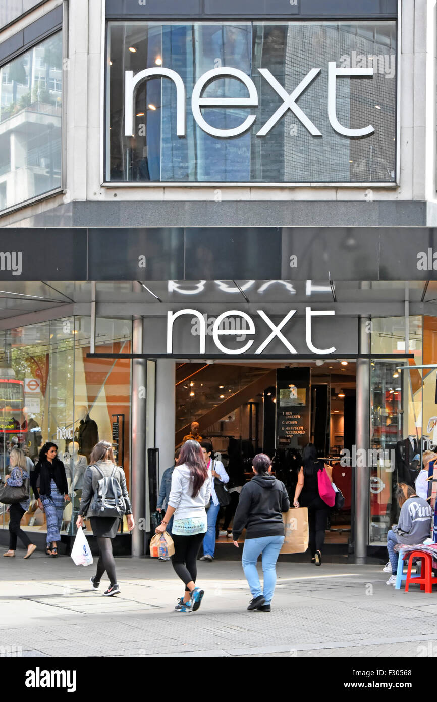 Next store shop entrance for retail clothing shopping shop front on Oxford Street West End London England UK with shoppers on pavement Stock Photo