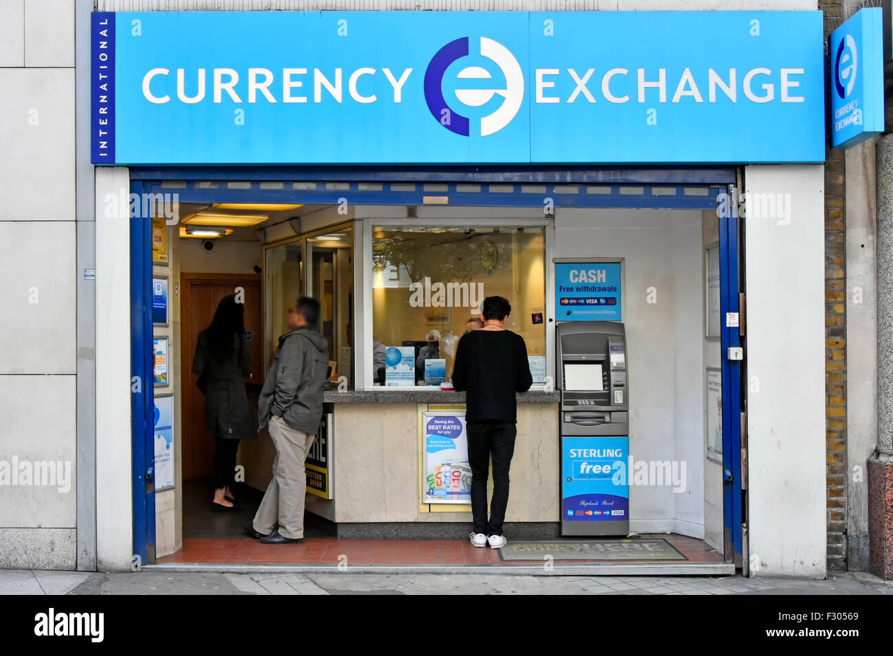 Bureau de Change International Currency Exchange retail booth & atm in premises in Oxford Street West End of London England UK digitally obscured face Stock Photo