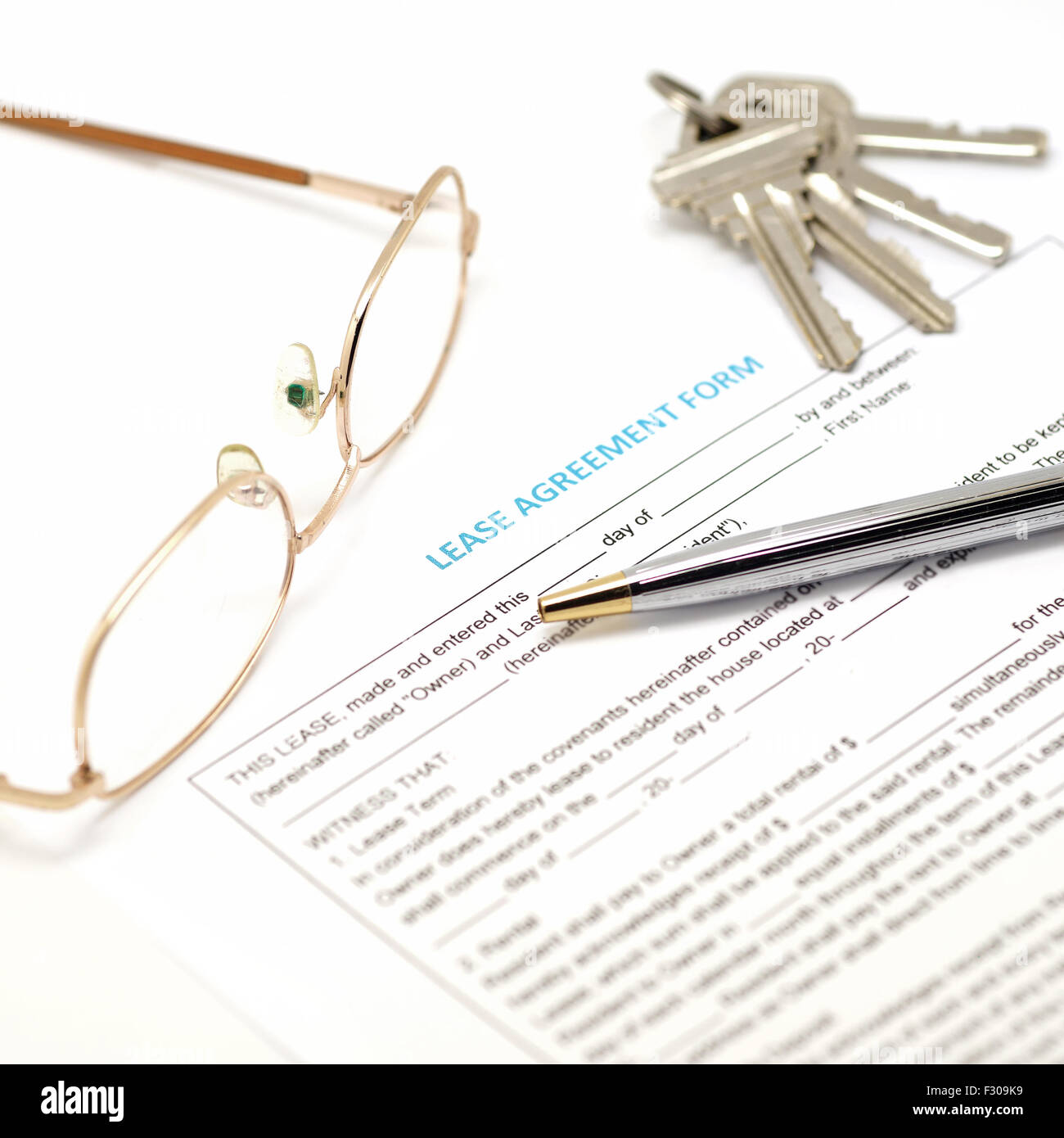 lease agreement document with key and pen Stock Photo