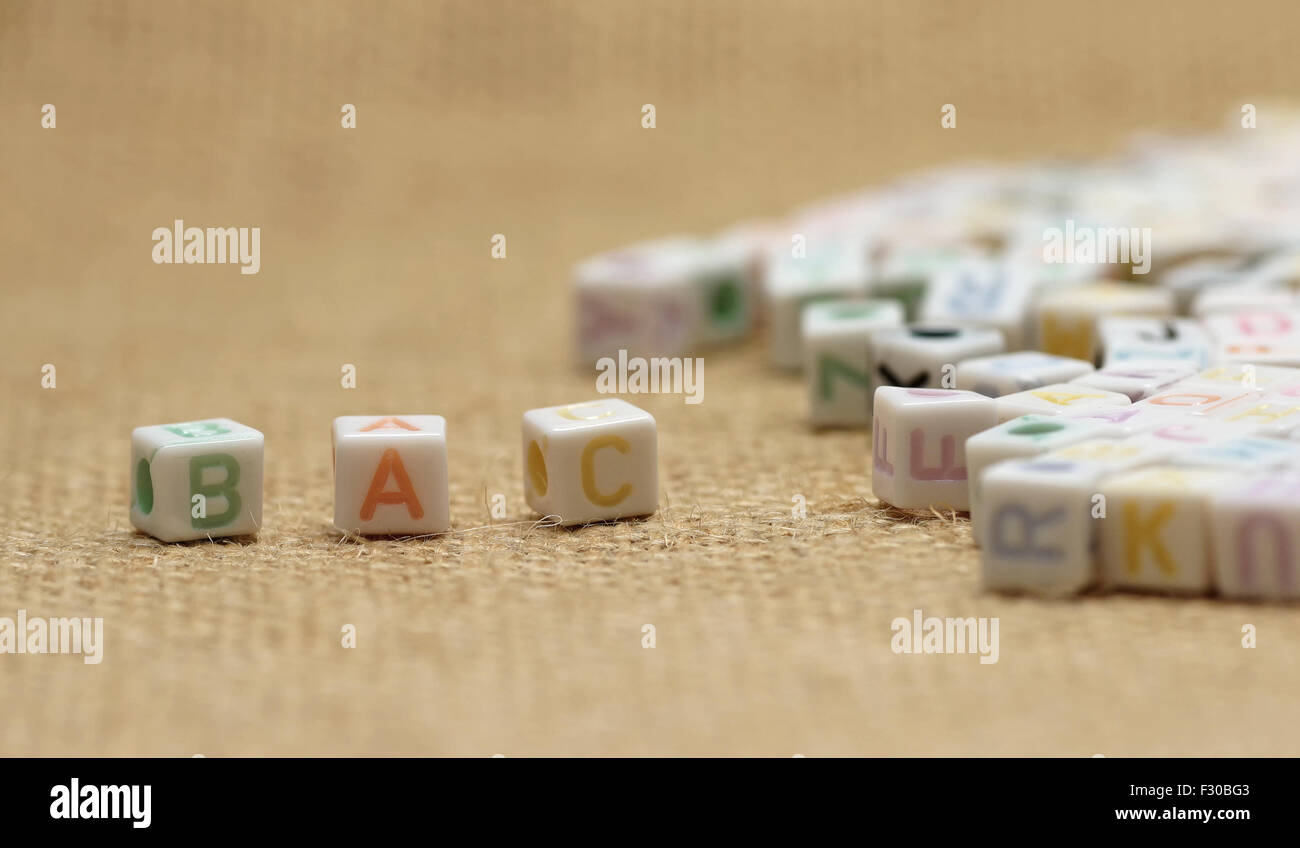 abc english alphabet on burlap fabric background Stock Photo - Alamy