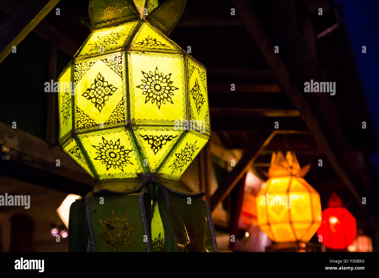 Colorful lamp under ceiling, Chiang Khan, Thailand Stock Photo