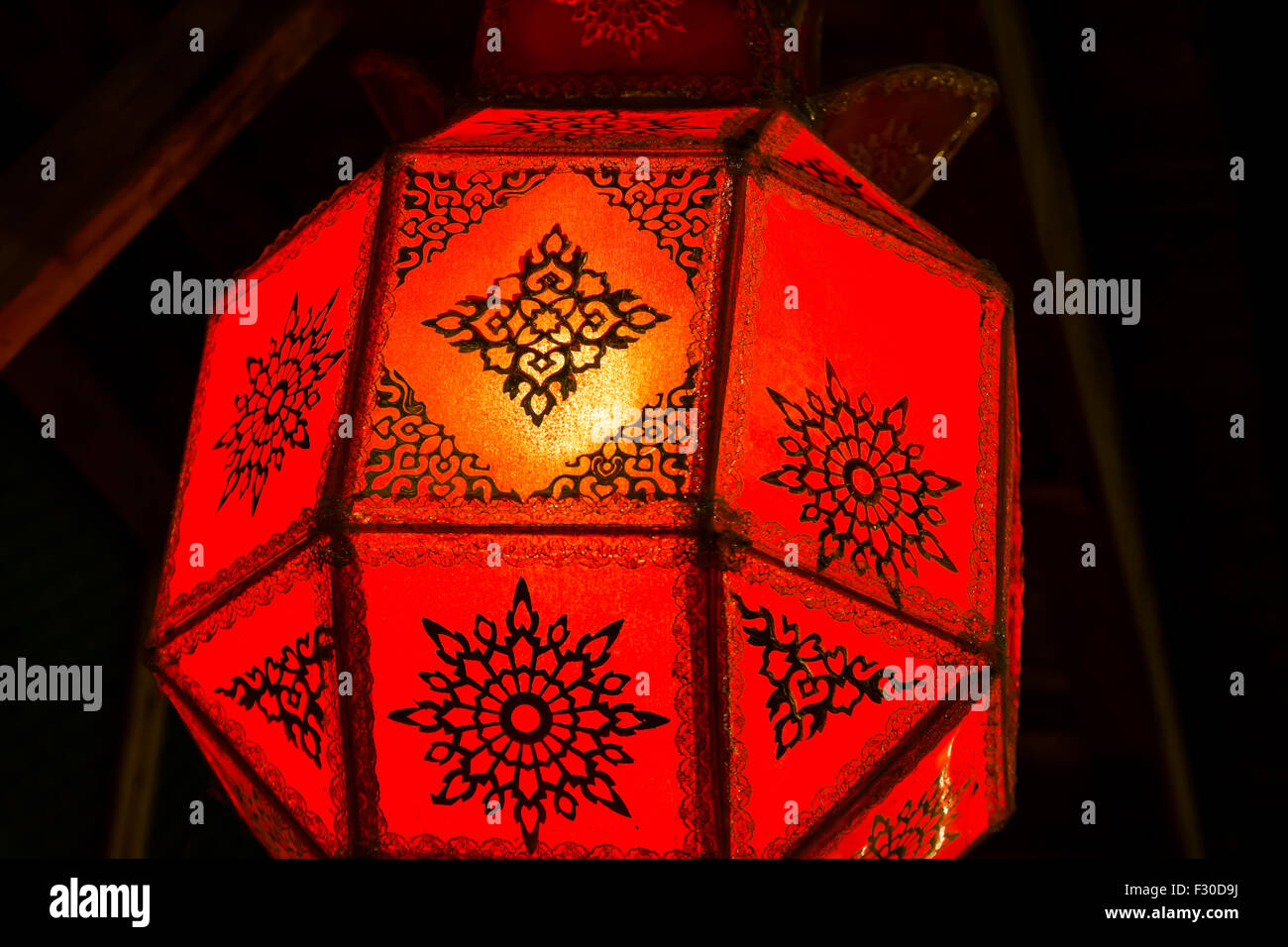 Red lamp under ceiling, Chiang Khan, Thailand Stock Photo