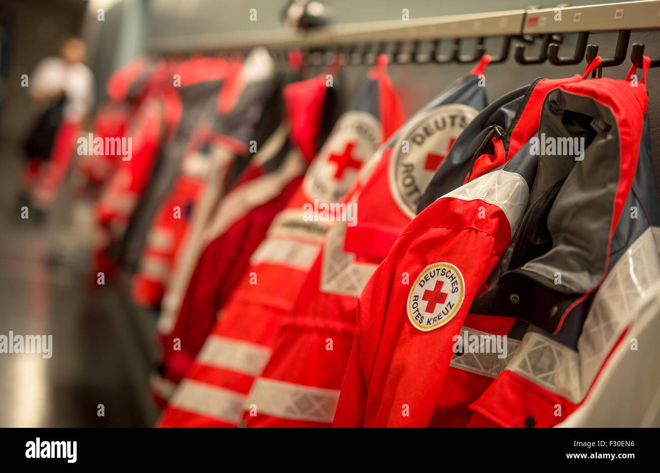 Munich, Germany. 23rd Sep, 2015. Jackets of paramedics of the German Red Cross hanging on coat hooks at the first-aid station at the 182nd Oktoberfest in Munich, Germany, 23 September 2015. 8,000 patients were treated at the station run by the German Red Cross last year, with 680 of them suffering from alcohol poisoning. The world's largest beer festival which will run until 04 October 2015 is expected to attract some six million visitors from all over the world this year. Photo: MATTHIAS BALK/dpa/Alamy Live News Stock Photo