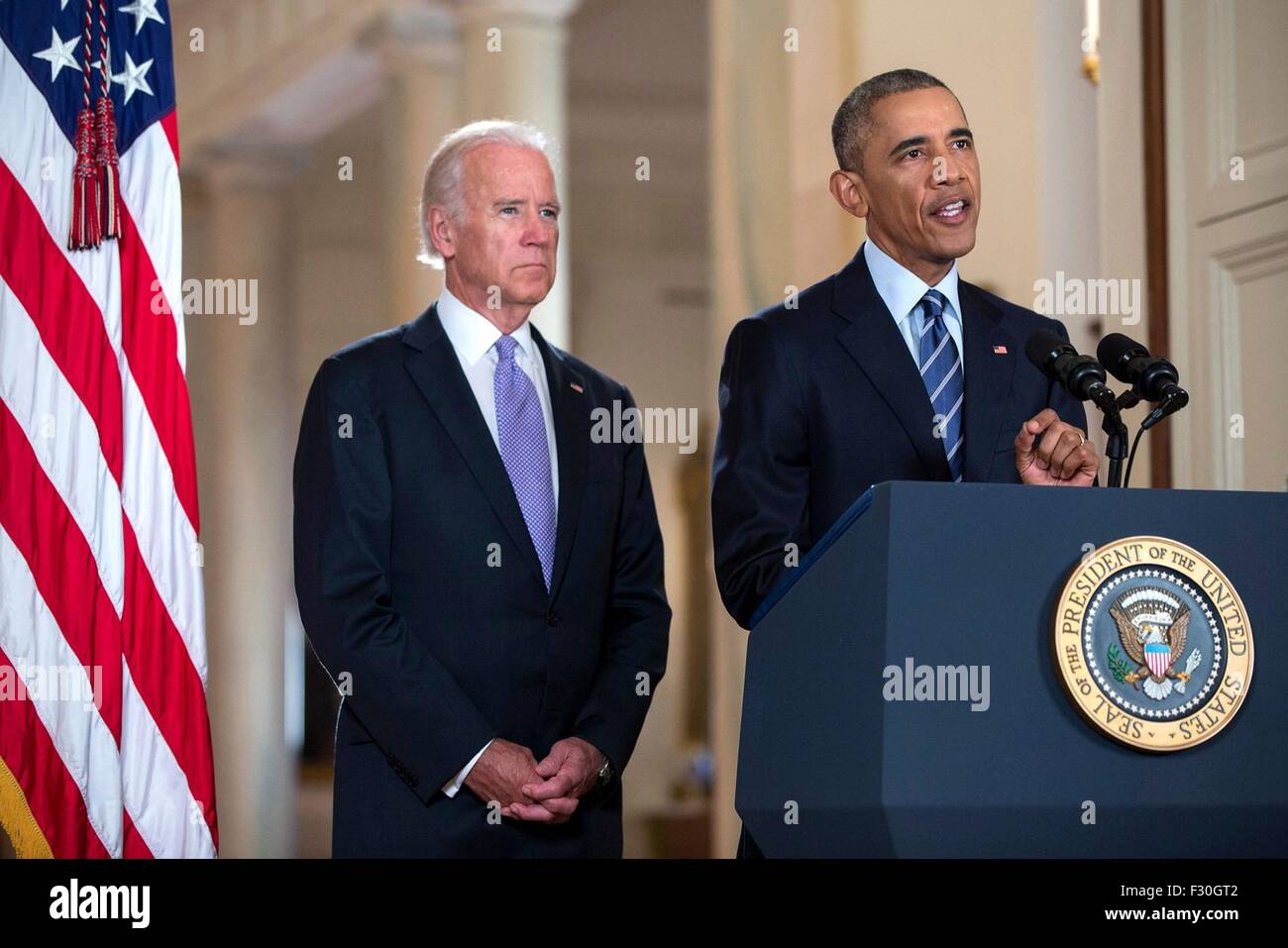 U.S. President Barack Obama discusses the Iranian nuclear agreement as Vice President Joe Biden looks on in the East Room of the White House August 20, 2015 in Washington, DC. Stock Photo