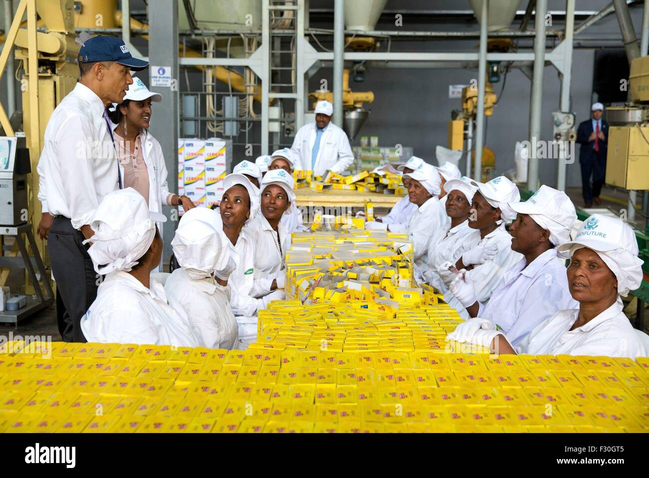 U.S. President Barack Obama greets workers during a tour of the factory floor of [Faffa Foods], which is supported by the U.S. government's Feed the Future program July 28, 2015 in Addis Ababa, Ethiopia. Stock Photo